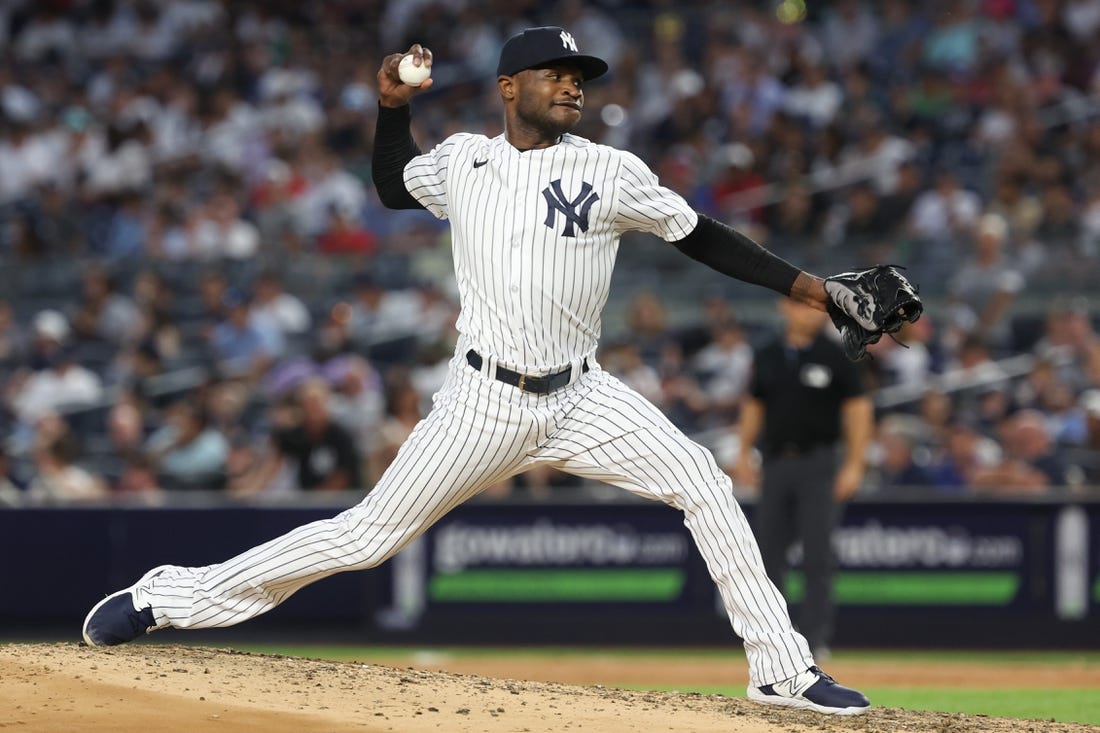 Jul 31, 2023; Bronx, New York, USA; New York Yankees starting pitcher Domingo German (0) delivers a pitch during the seventh inning against the Tampa Bay Rays at Yankee Stadium. Mandatory Credit: Vincent Carchietta-USA TODAY Sports