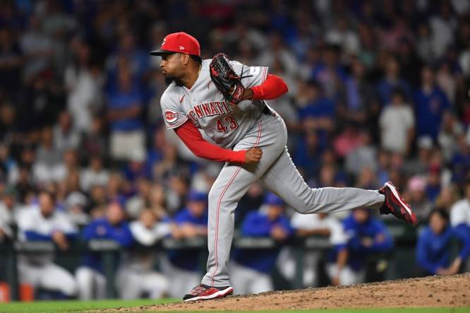 MLB roundup: Bullpen guides Reds past Cubs