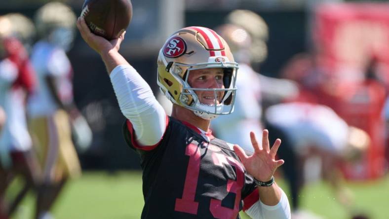 Jul 27, 2023; Santa Clara, CA, USA; San Francisco 49ers quarterback Brock Purdy (13) throws a pass during training camp at the SAP Performance Facility. Mandatory Credit: Robert Edwards-USA TODAY Sports