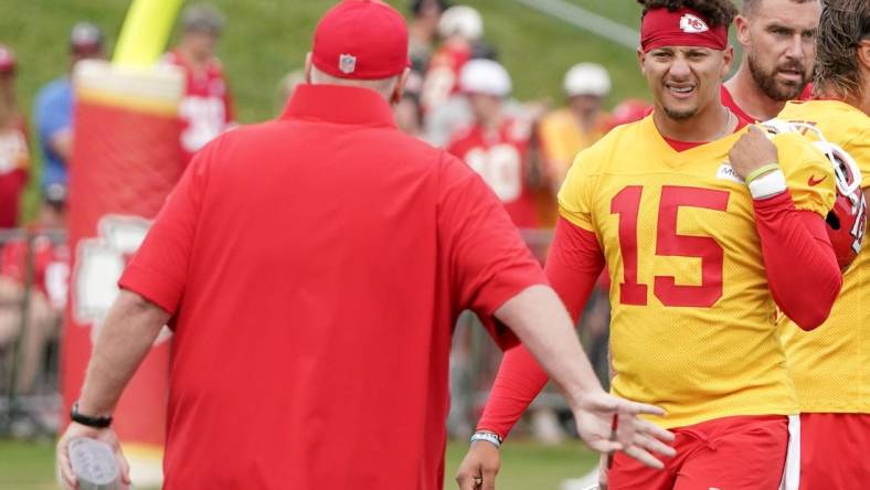 Jul 24, 2023; St. Joseph, MO, USA; Kansas City Chiefs head coach Andy Reid talks with quarterback Patrick Mahomes (15) during training camp at Missouri Western State University. Mandatory Credit: Denny Medley-USA TODAY Sports