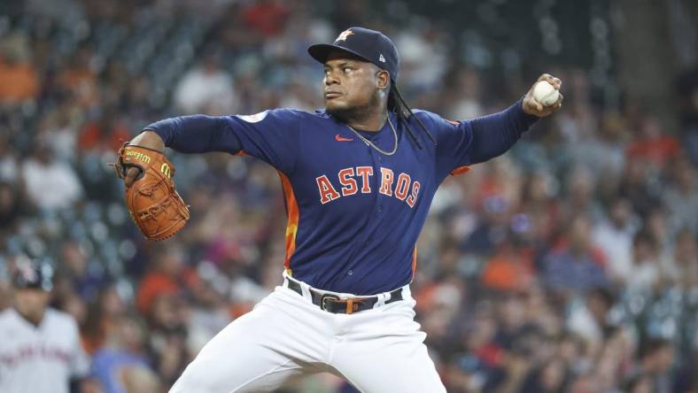 Aug 1, 2023; Houston, Texas, USA; Houston Astros starting pitcher Framber Valdez (59) delivers a pitch during the first inning against the Cleveland Guardians at Minute Maid Park. Mandatory Credit: Troy Taormina-USA TODAY Sports