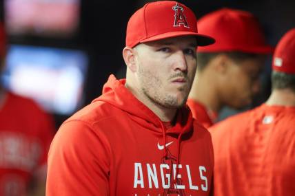 Aug 1, 2023; Atlanta, Georgia, USA; Los Angeles Angels outfielder Mike Trout (27) in the dugout against the Atlanta Braves in the seventh inning at Truist Park. Mandatory Credit: Brett Davis-USA TODAY Sports