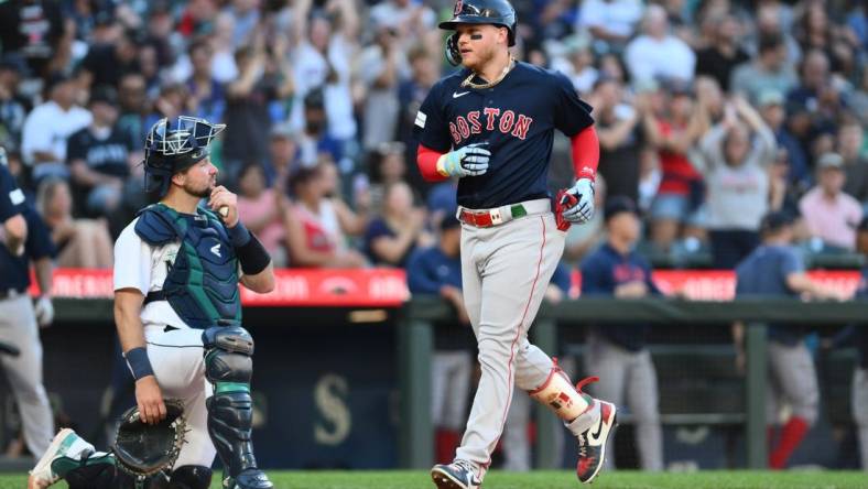 Aug 1, 2023; Seattle, Washington, USA; Boston Red Sox designated hitter Alex Verdugo (99) crosses home plate after hitting a two run home run against the Seattle Mariners during the fifth inning at T-Mobile Park. Mandatory Credit: Steven Bisig-USA TODAY Sports