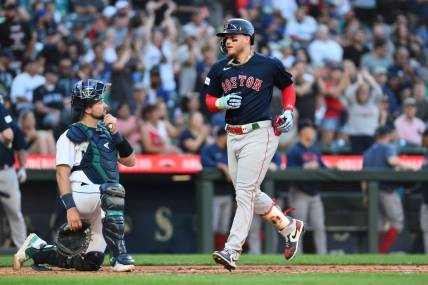 Aug 1, 2023; Seattle, Washington, USA; Boston Red Sox designated hitter Alex Verdugo (99) crosses home plate after hitting a two run home run against the Seattle Mariners during the fifth inning at T-Mobile Park. Mandatory Credit: Steven Bisig-USA TODAY Sports
