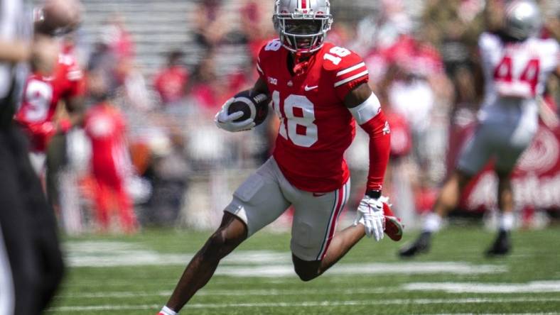 Apr 15, 2023; Columbus, Ohio, United States;  Ohio State Buckeyes wide receiver Marvin Harrison Jr. (18) sprints down the side of the field during the first quarter of the Ohio State Buckeyes spring game at Ohio Stadium on Saturday morning. Mandatory Credit: Joseph Scheller-The Columbus Dispatch