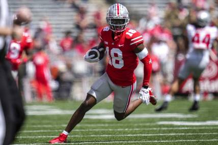 Apr 15, 2023; Columbus, Ohio, United States;  Ohio State Buckeyes wide receiver Marvin Harrison Jr. (18) sprints down the side of the field during the first quarter of the Ohio State Buckeyes spring game at Ohio Stadium on Saturday morning. Mandatory Credit: Joseph Scheller-The Columbus Dispatch