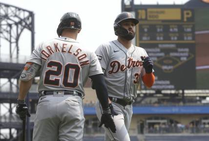 Aug 2, 2023; Pittsburgh, Pennsylvania, USA;  Detroit Tigers first baseman Spencer Torkelson (20) congratulates center fielder Riley Greene (31) crossing home plate on a solo home run against the Pittsburgh Pirates during the first inning at PNC Park. Mandatory Credit: Charles LeClaire-USA TODAY Sports