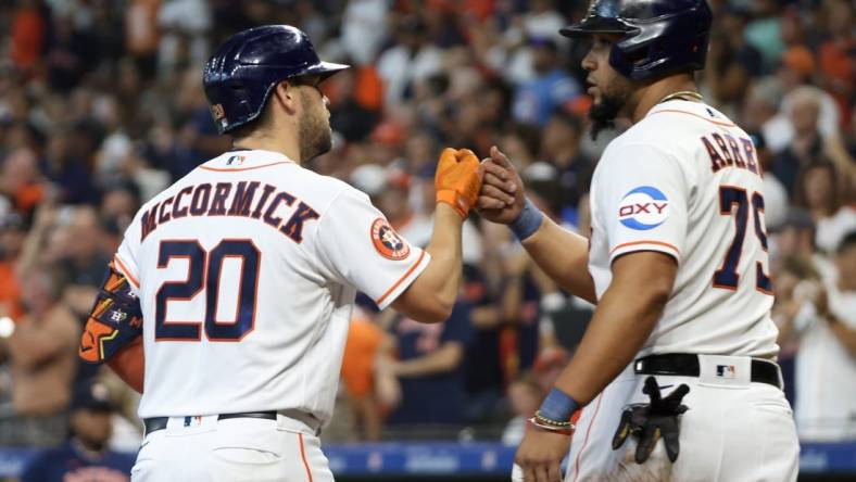 Aug 2, 2023; Houston, Texas, USA; Houston Astros first baseman Jose Abreu (79) celebrates after a two-run home run by center fielder Chas McCormick (20) in the second inning  at Minute Maid Park. Mandatory Credit: Thomas Shea-USA TODAY Sports