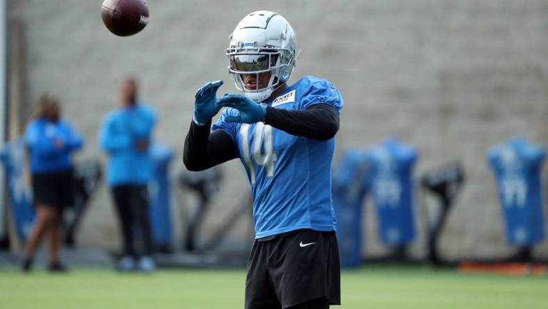 Lions wide receiver Amon-Ra St. Brown catches passes during training camp on Wednesday, Aug. 02, 2023, in Allen Park.
