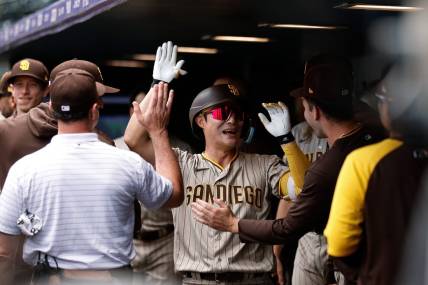 Aug 2, 2023; Denver, Colorado, USA; San Diego Padres third baseman Ha-Seong Kim (7) celebrates his solo home run in the first inning against the Colorado Rockies at Coors Field. Mandatory Credit: Isaiah J. Downing-USA TODAY Sports