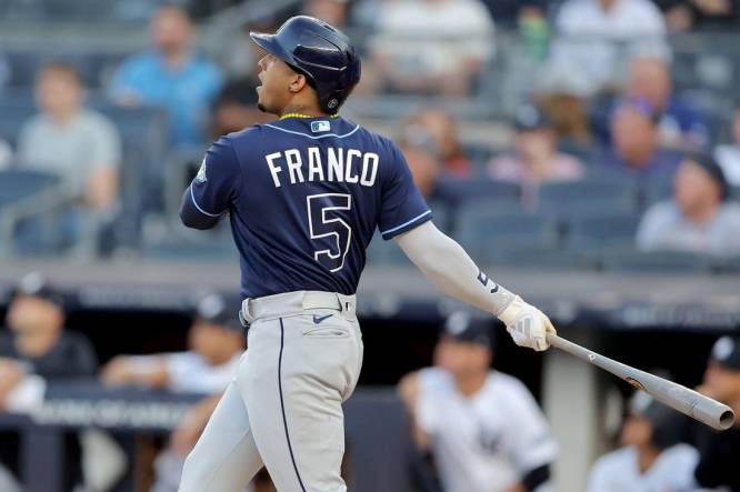 Aug 2, 2023; Bronx, New York, USA; Tampa Bay Rays shortstop Wander Franco (5) follows through on a two run home run against the New York Yankees during the first inning at Yankee Stadium. Mandatory Credit: Brad Penner-USA TODAY Sports