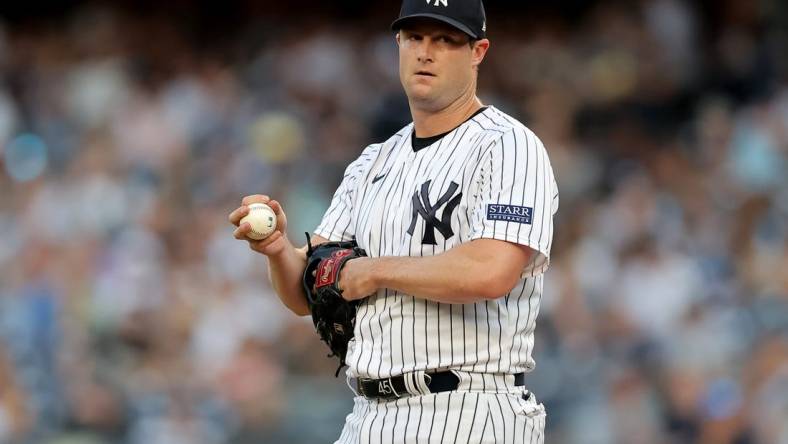 Aug 2, 2023; Bronx, New York, USA; New York Yankees starting pitcher Gerrit Cole (45) reacts during the first inning against the Tampa Bay Rays at Yankee Stadium. Mandatory Credit: Brad Penner-USA TODAY Sports