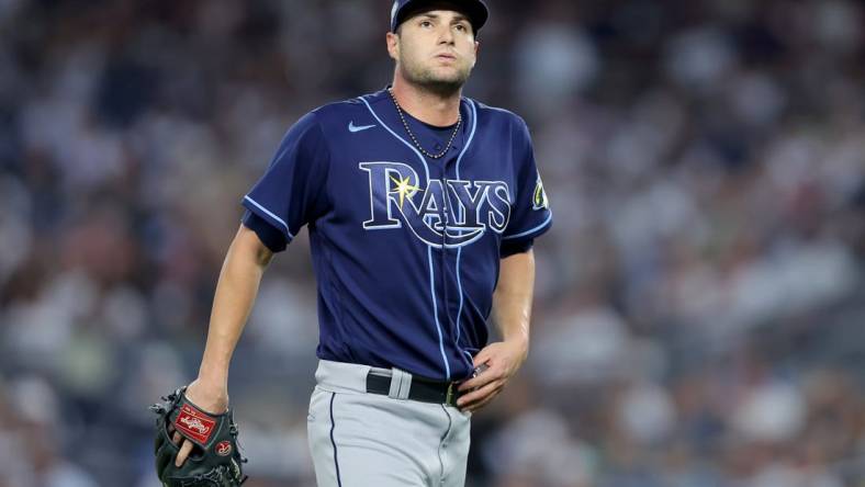 Aug 2, 2023; Bronx, New York, USA; Tampa Bay Rays starting pitcher Shane McClanahan (18) reacts during the fourth inning against the New York Yankees at Yankee Stadium. Mandatory Credit: Brad Penner-USA TODAY Sports