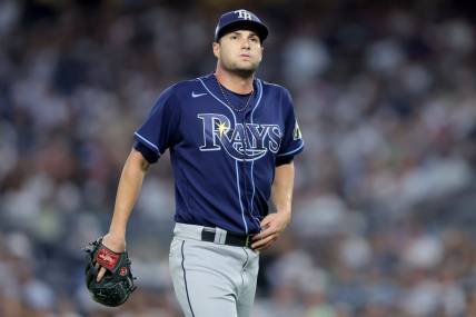 Aug 2, 2023; Bronx, New York, USA; Tampa Bay Rays starting pitcher Shane McClanahan (18) reacts during the fourth inning against the New York Yankees at Yankee Stadium. Mandatory Credit: Brad Penner-USA TODAY Sports