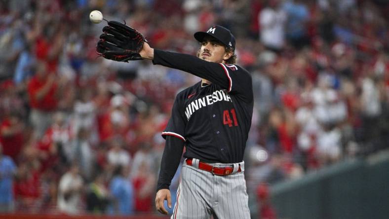 Aug 2, 2023; St. Louis, Missouri, USA;  Minnesota Twins starting pitcher Joe Ryan (41) catches a new baseball after giving up a two run home run to St. Louis Cardinals center fielder Lars Nootbaar (not pictured) during the second inning at Busch Stadium. Mandatory Credit: Jeff Curry-USA TODAY Sports