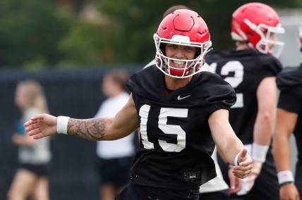 Georgia quarterback Carson Beck (15) reacts during the first day fall football camp in Athens, Ga., on Thursday, Aug. 3, 2023.