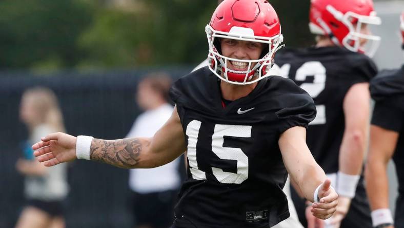 Georgia quarterback Carson Beck (15) reacts during the first day fall football camp in Athens, Ga., on Thursday, Aug. 3, 2023.