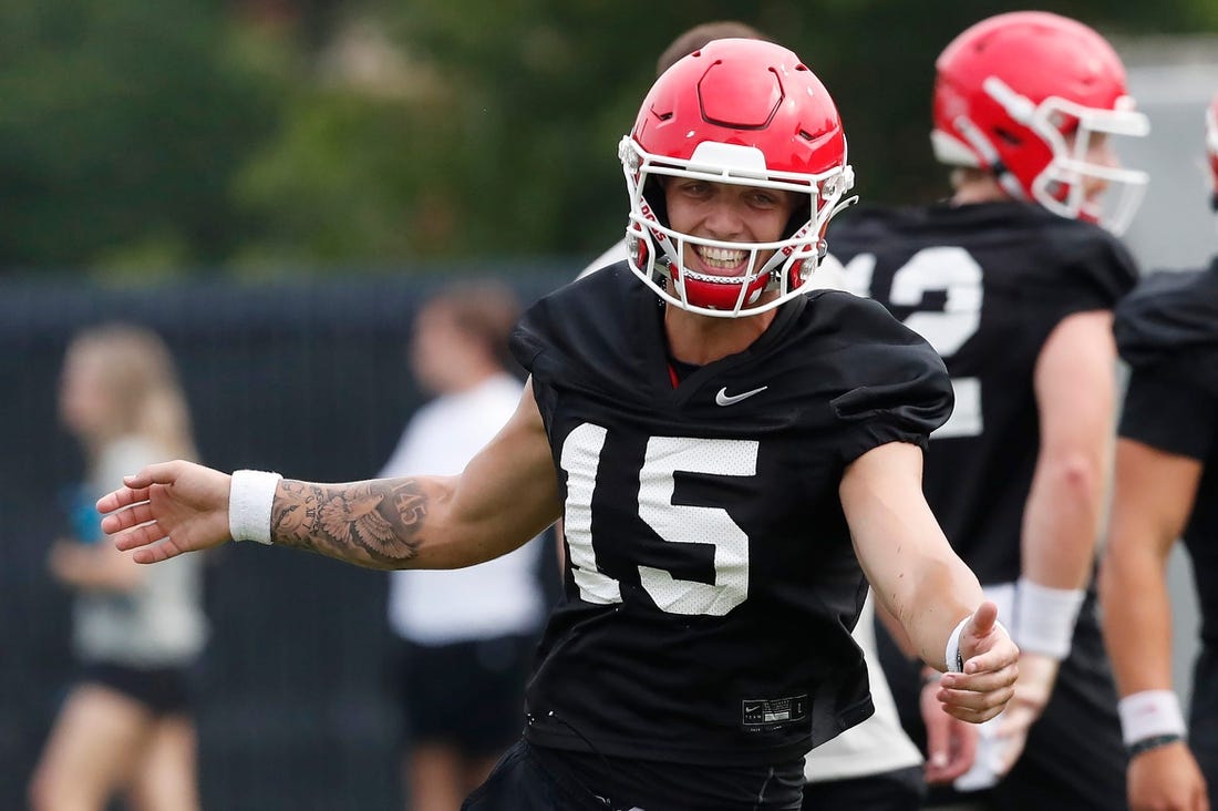 Georgia quarterback Carson Beck (15) reacts during the first day fall football camp in Athens, Ga., on Thursday, Aug. 3, 2023.