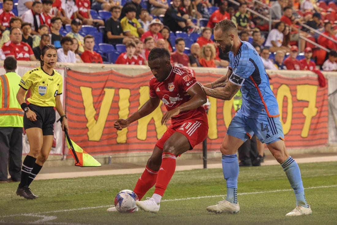 Aug 3, 2023; Harrison, NJ, USA; New York Red Bulls forward Elias Manoel (11) and New York City FC defender Maxime Chanot (4) battle for the ball during the second half at Red Bull Arena. Mandatory Credit: Ed Mulholland-USA TODAY Sports