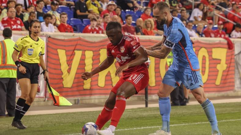 Aug 3, 2023; Harrison, NJ, USA; New York Red Bulls forward Elias Manoel (11) and New York City FC defender Maxime Chanot (4) battle for the ball during the second half at Red Bull Arena. Mandatory Credit: Ed Mulholland-USA TODAY Sports