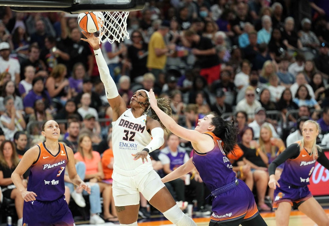 Aug 3, 2023; Phoenix, Arizona, USA; Atlanta Dream forward Cheyenne Parker (32) puts up a layup against Phoenix Mercury center Megan Gustafson (10) during the second half at Footprint Center. Mandatory Credit: Joe Camporeale-USA TODAY Sports