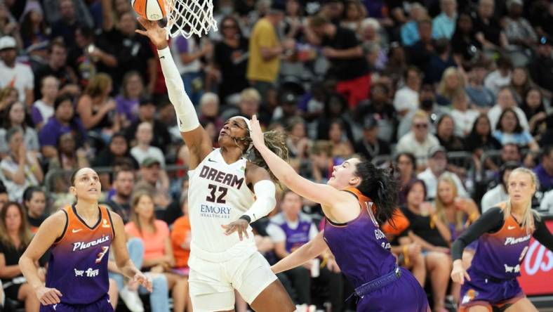 Aug 3, 2023; Phoenix, Arizona, USA; Atlanta Dream forward Cheyenne Parker (32) puts up a layup against Phoenix Mercury center Megan Gustafson (10) during the second half at Footprint Center. Mandatory Credit: Joe Camporeale-USA TODAY Sports