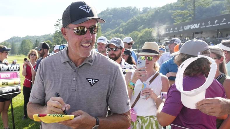 Aug 4, 2023; White Sulphur Springs, West Virginia, USA; Phil Mickelson signs autographs after the first round of the LIV Golf event at The Old White Course. Mandatory Credit: Bob Donnan-USA TODAY Sports