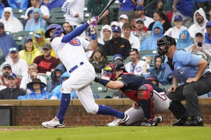 Aug 5, 2023; Chicago, Illinois, USA; Chicago Cubs shortstop Dansby Swanson (7) hits a two-run home run against the Atlanta Braves during the first inning at Wrigley Field. Mandatory Credit: David Banks-USA TODAY Sports