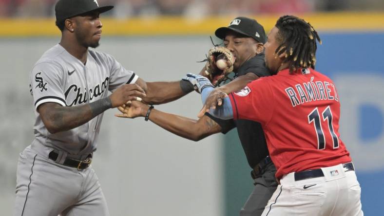 Aug 5, 2023; Cleveland, Ohio, USA; Umpire Malachi Moore tries to separate Cleveland Guardians third baseman Jose Ramirez (11) and Chicago White Sox shortstop Tim Anderson (7) after Ramirez slid into second with an RBI double during the sixth inning at Progressive Field. Mandatory Credit: Ken Blaze-USA TODAY Sports