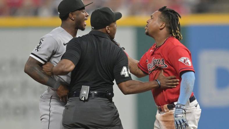 Aug 5, 2023; Cleveland, Ohio, USA; Umpire Malachi Moore tries to separate Cleveland Guardians third baseman Jose Ramirez (11) and Chicago White Sox shortstop Tim Anderson (7) after Ramirez slid into second with an RBI double during the sixth inning at Progressive Field. Mandatory Credit: Ken Blaze-USA TODAY Sports