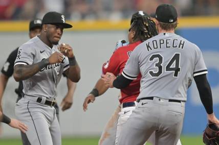 Aug 5, 2023; Cleveland, Ohio, USA; Chicago White Sox shortstop Tim Anderson (7) raises his fists to fight Cleveland Guardians third baseman Jose Ramirez (11) during the sixth inning at Progressive Field. Mandatory Credit: Ken Blaze-USA TODAY Sports