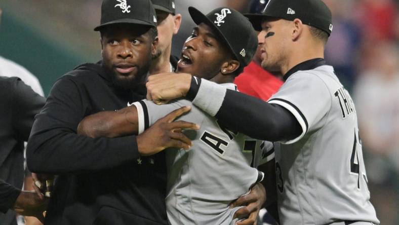 Aug 5, 2023; Cleveland, Ohio, USA; Teammates hold back Chicago White Sox shortstop Tim Anderson (7) after Anderson and Cleveland Guardians third baseman Jose Ramirez (not pictured) got into a fight during the sixth inning at Progressive Field. Mandatory Credit: Ken Blaze-USA TODAY Sports