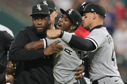 Aug 5, 2023; Cleveland, Ohio, USA; Teammates hold back Chicago White Sox shortstop Tim Anderson (7) after Anderson and Cleveland Guardians third baseman Jose Ramirez (not pictured) got into a fight during the sixth inning at Progressive Field. Mandatory Credit: Ken Blaze-USA TODAY Sports