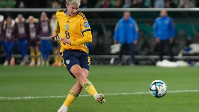 Aug 6, 2023; Melbourne, AUS; Sweden forward Lina Hurtig (8) shoots and scores the winning goal in the penalty kick shootout during a Round of 16 match in the 2023 FIFA Women's World Cup at Melbourne Rectangular Stadium. Mandatory Credit: Jenna Watson-USA TODAY Sports