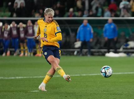 Aug 6, 2023; Melbourne, AUS; Sweden forward Lina Hurtig (8) shoots and scores the winning goal in the penalty kick shootout during a Round of 16 match in the 2023 FIFA Women's World Cup at Melbourne Rectangular Stadium. Mandatory Credit: Jenna Watson-USA TODAY Sports