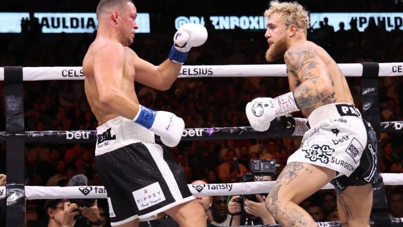 Aug 5, 2023; Dallas, Texas, USA;  Jake Paul (right) fights  against Nate Diaz in a boxing match at American Airlines Center. Mandatory Credit: Kevin Jairaj-USA TODAY Sports