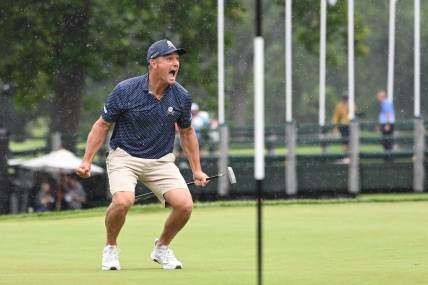 Aug 6, 2023; White Sulphur Springs, West Virginia, USA; Bryson DeChambeau celebrates after hitting a birdie putt on 18 and shooting a record 58 during the final round of the LIV Golf event at The Old White Course. Mandatory Credit: Bob Donnan-USA TODAY Sports