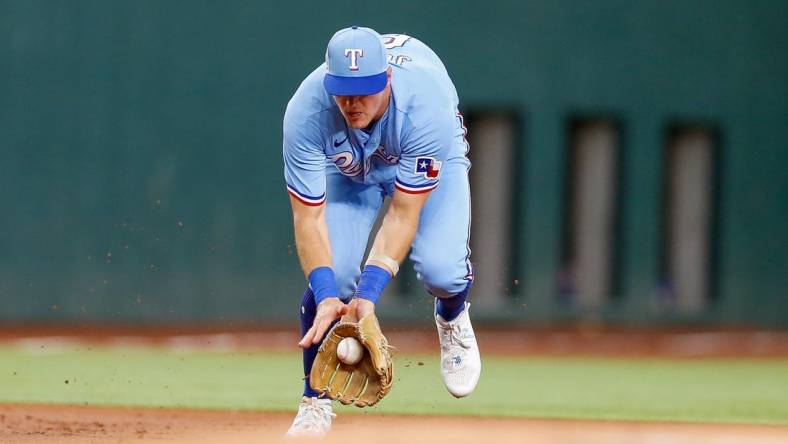 Aug 6, 2023; Arlington, Texas, USA; Texas Rangers third baseman Josh Jung (6) fields a ground ball during the first inning against the Miami Marlins at Globe Life Field. Mandatory Credit: Andrew Dieb-USA TODAY Sports