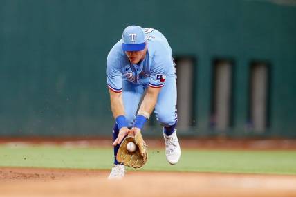 Aug 6, 2023; Arlington, Texas, USA; Texas Rangers third baseman Josh Jung (6) fields a ground ball during the first inning against the Miami Marlins at Globe Life Field. Mandatory Credit: Andrew Dieb-USA TODAY Sports