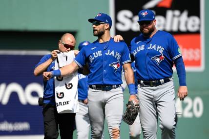 Aug 6, 2023; Boston, Massachusetts, USA; Toronto Blue Jays center fielder Kevin Kiermaier (39) gets medical attention to his left arm during the sixth inning against the Boston Red Sox at Fenway Park. Mandatory Credit: Eric Canha-USA TODAY Sports
