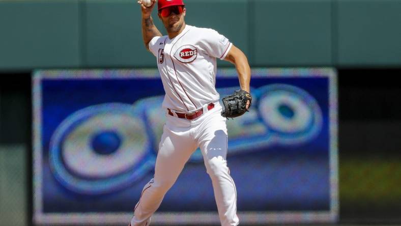 Aug 6, 2023; Cincinnati, Ohio, USA; Cincinnati Reds third baseman Nick Senzel (15) throws to first to get Washington Nationals third baseman Ildemaro Vargas (not pictured) out in the fifth inning at Great American Ball Park. Mandatory Credit: Katie Stratman-USA TODAY Sports