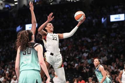 Aug 6, 2023; Brooklyn, New York, USA;  Las Vegas Aces forward A'ja Wilson (22) drives to the basket in the third quarter against the New York Liberty at Barclays Center. Mandatory Credit: Wendell Cruz-USA TODAY Sports