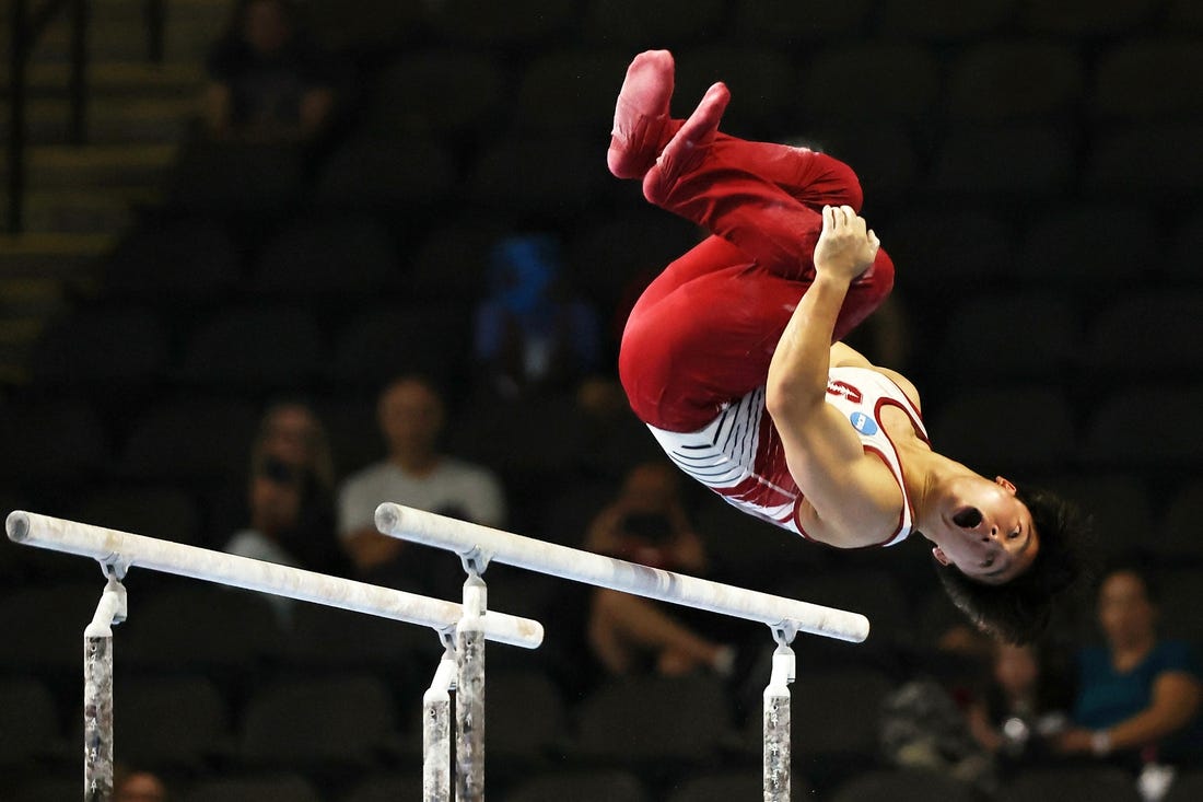 Aug 6, 2023; Hoffman Estates, Illinois, USA; Asher Hong performs on the parallel bars during the Core Hydration Classic at NOW Arena. Mandatory Credit: Jon Durr-USA TODAY Sports