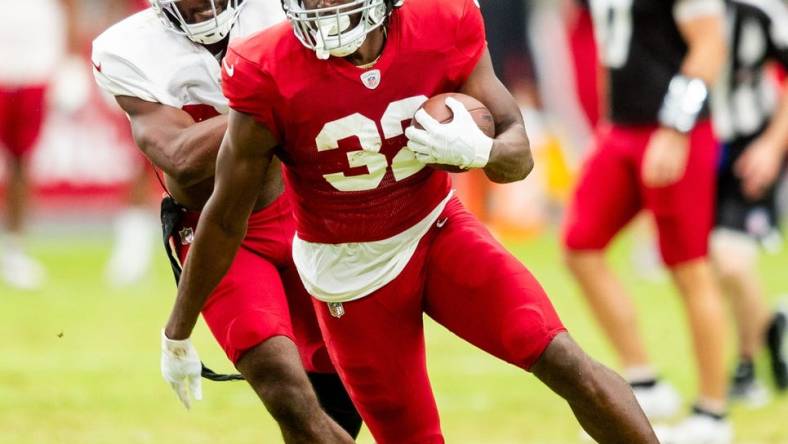 RB Marlon Mack runs with the ball during the Arizona Cardinals' annual Red & White practice at State Farm Stadium in Glendale on Aug. 5, 2023.