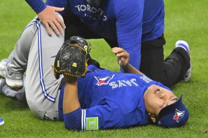 Aug 7, 2023; Cleveland, Ohio, USA; Toronto Blue Jays starting pitcher Hyun Jin Ryu (99) reacts after he was hit by a batted ball in the fourth inning against the Cleveland Guardians at Progressive Field. Mandatory Credit: David Richard-USA TODAY Sports