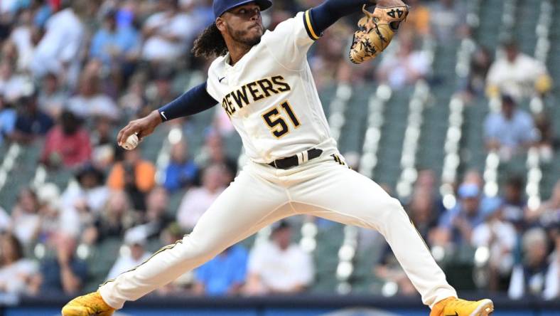 Aug 7, 2023; Milwaukee, Wisconsin, USA; Milwaukee Brewers starting pitcher Freddy Peralta (51) delivers a pitch against the Colorado Rockies in the first inning at American Family Field. Mandatory Credit: Michael McLoone-USA TODAY Sports