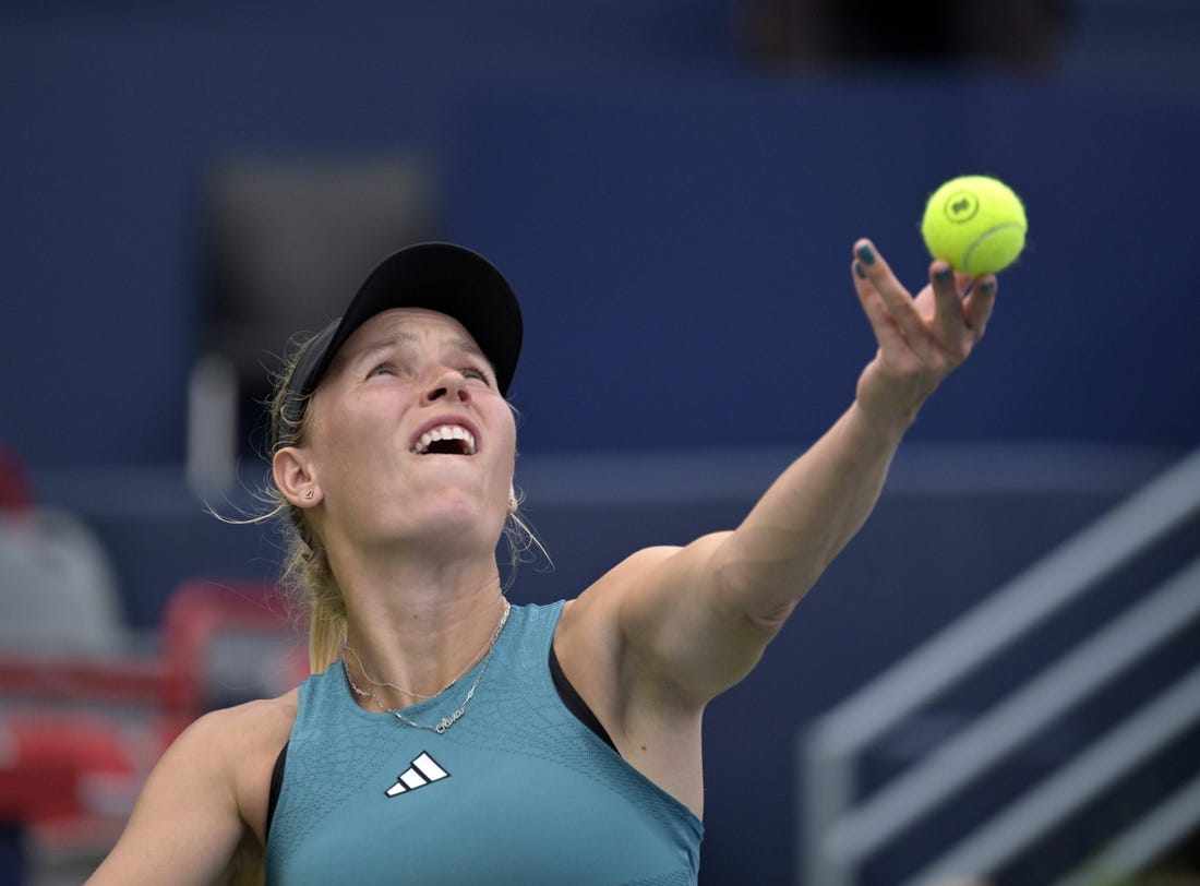 Aug 8, 2023; Montreal, Quebec, Canada; Caroline Wozniacki (DEN) serves against Kimberly Birrell (AUS) (not pictured) during first round play at IGA Stadium. Mandatory Credit: Eric Bolte-USA TODAY Sports