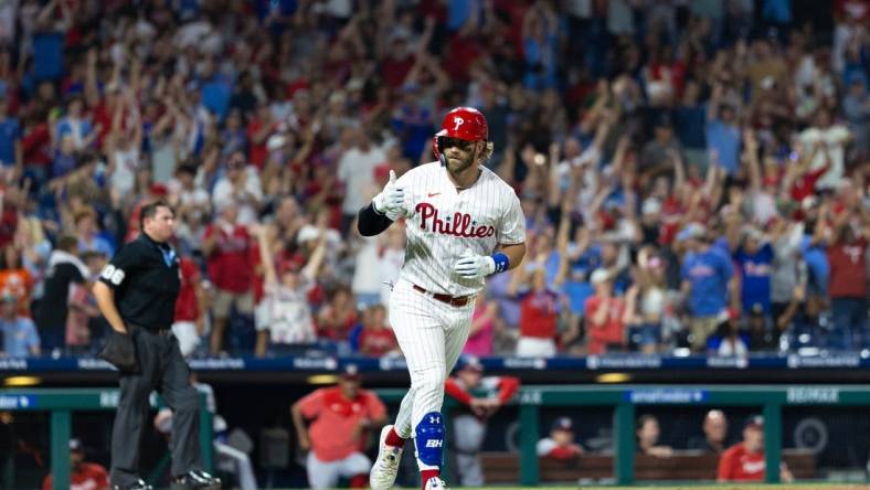 Aug 8, 2023; Philadelphia, Pennsylvania, USA; Philadelphia Phillies designated hitter Bryce Harper (3) reacts after hitting a two RBI home run during the fifth inning against the Washington Nationals at Citizens Bank Park. Mandatory Credit: Bill Streicher-USA TODAY Sports