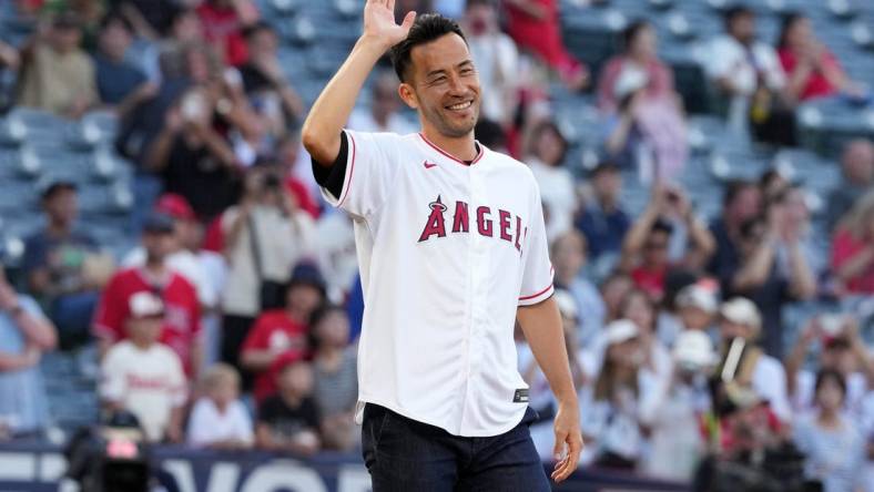 Aug 8, 2023; Anaheim, California, USA; LA Galaxy defender Maya Yoshida gestures after throwing the ceremonial first pitch before the game between the Los Angeles Angels and the San Francisco Giants at Angel Stadium. Mandatory Credit: Kirby Lee-USA TODAY Sports