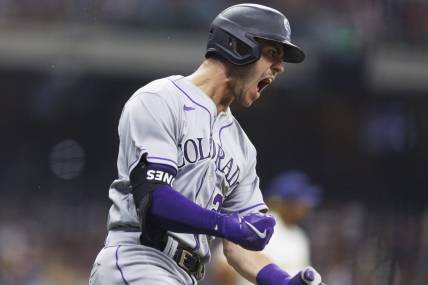 Aug 8, 2023; Milwaukee, Wisconsin, USA;  Colorado Rockies left fielder Nolan Jones (22) reacts after hitting a home run during the seventh inning against the Milwaukee Brewers at American Family Field. Mandatory Credit: Jeff Hanisch-USA TODAY Sports